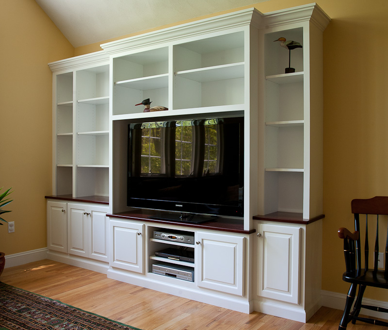 Painted built-in TV cabinet and bookcase with solid cherry accents by Coventry CT cabinet maker Bailey Carpentry