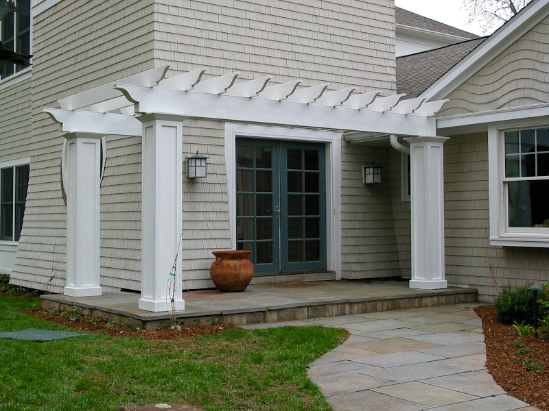 Entry pergola and white cedar sidewall shingles in Avon, CT